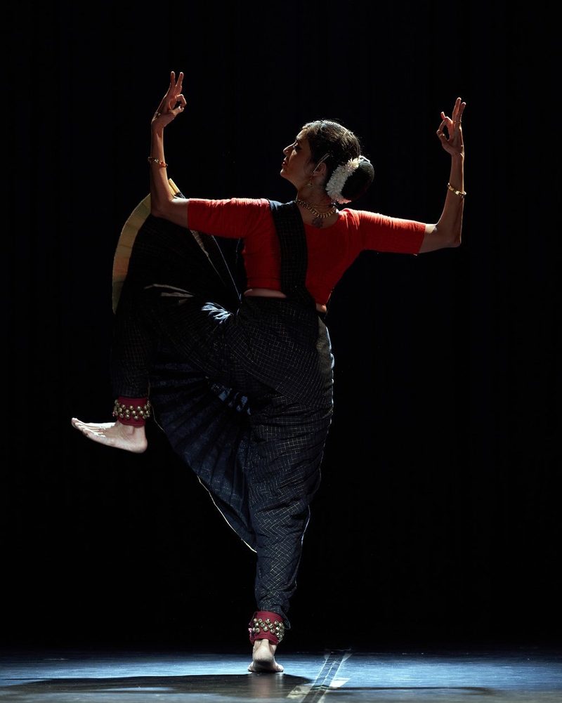 Arms framing the head, turning